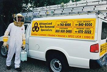 Sunlakes bee removal service truck and employee